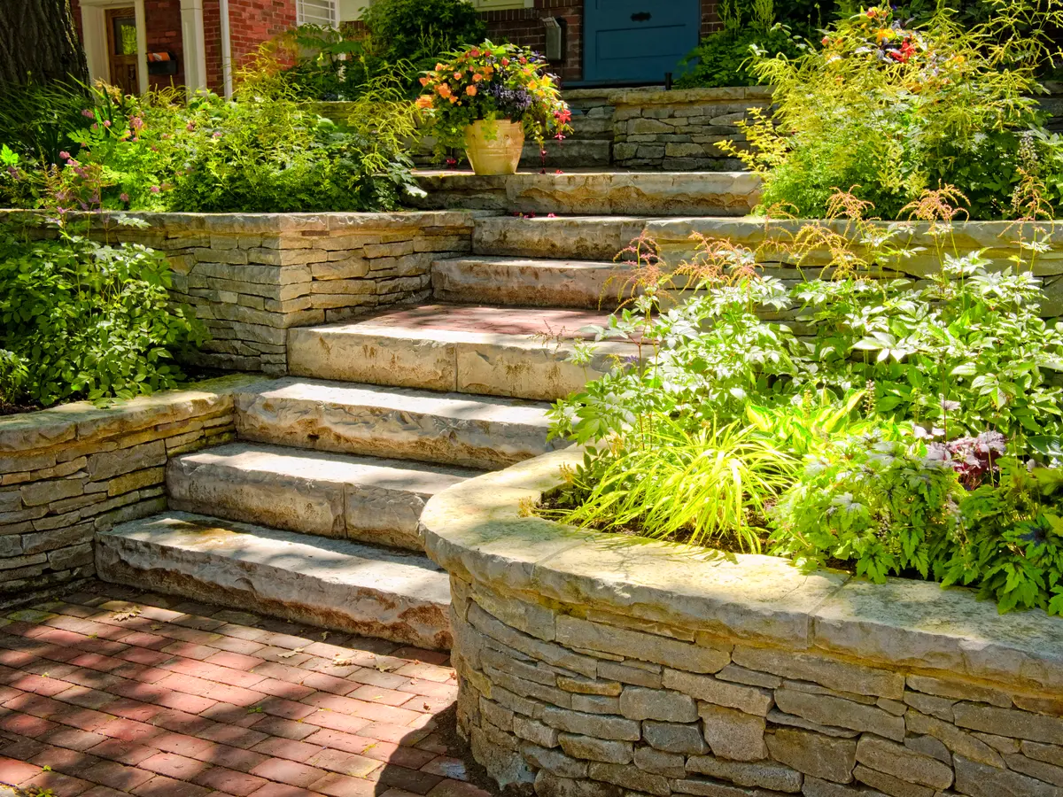 Natural stone garden steps between stone retaining walls